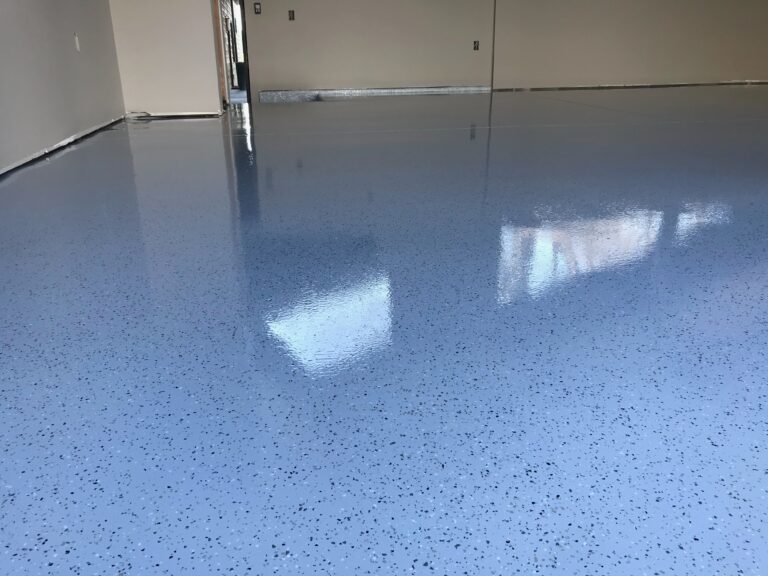 A blue polished concrete floor in a garage.