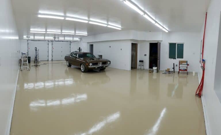 a mustang is parked in a spacious epoxy garage floor
