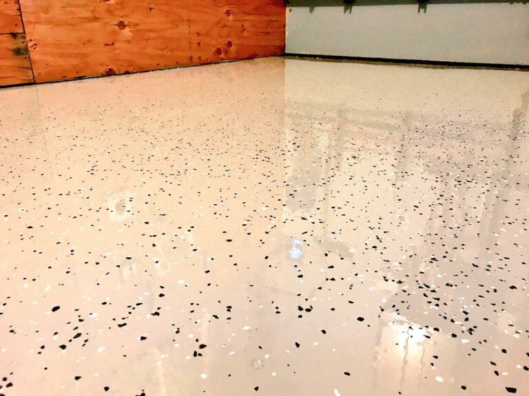 an interesting epoxy garage floor with a paper flake pattern