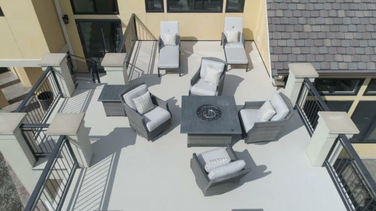 a urethane coated deck for a commercial building with lots of outdoor furniture