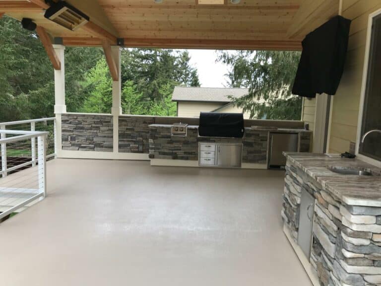 Monterey sand urethane deck with a stone barbeque grill